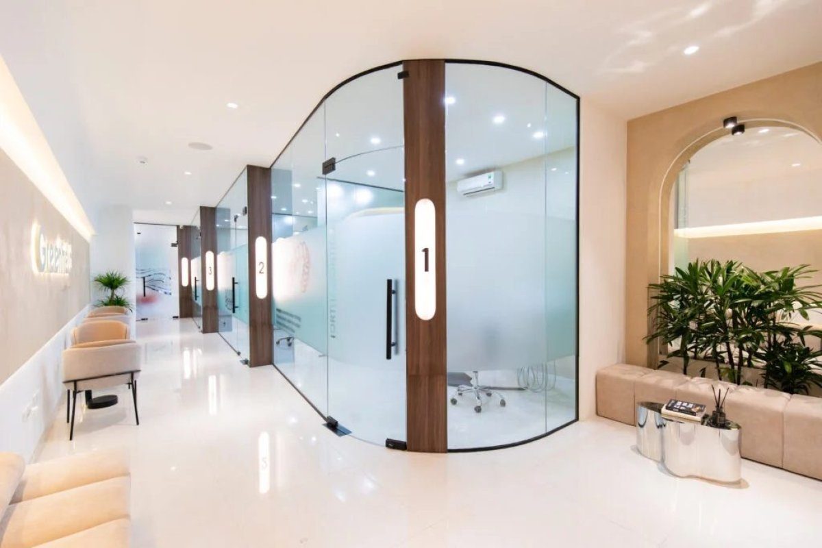 Glass-walled private treatment pods at Greenfield Dental Clinic