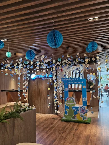 Minh Thu Dental reception lobby with branded entrance