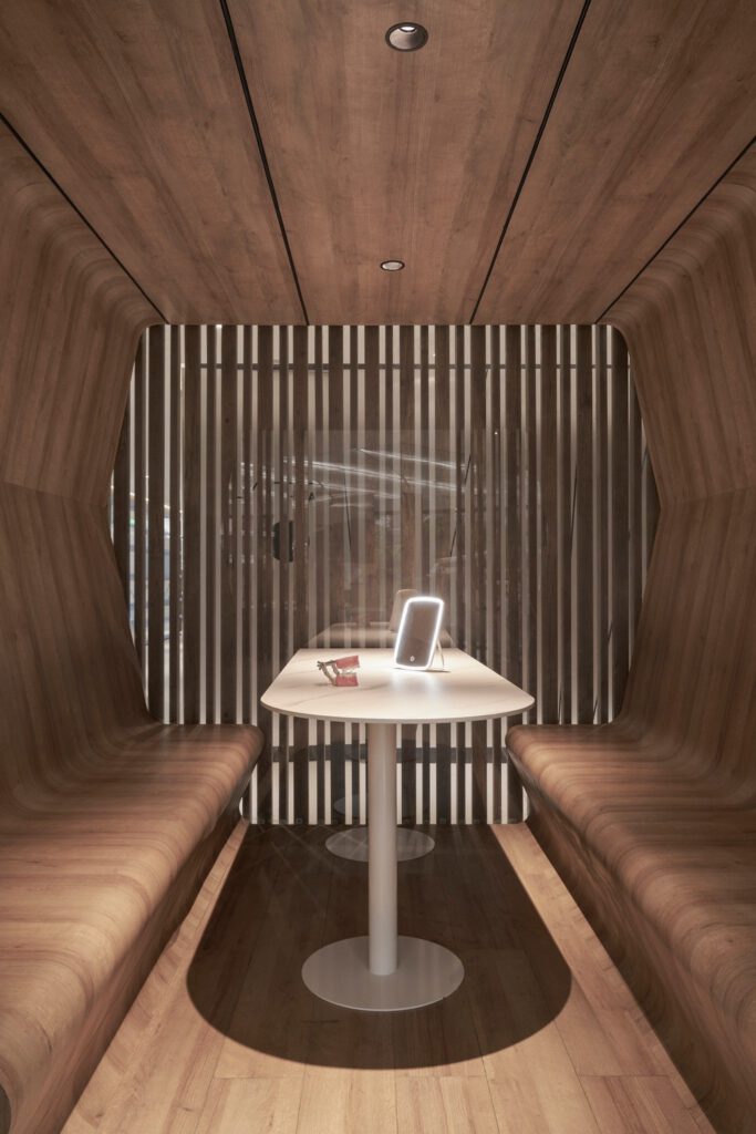 Private consultation booth with warm wood interior at Minh Thu Dental