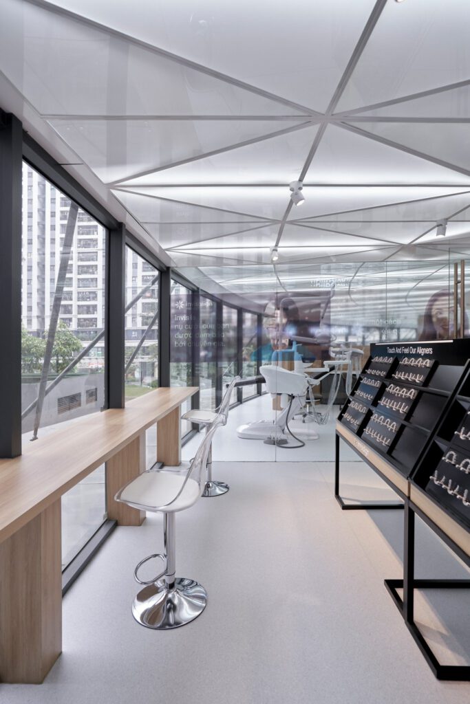 Waiting bar area with panoramic windows at Minh Thu Dental Clinic