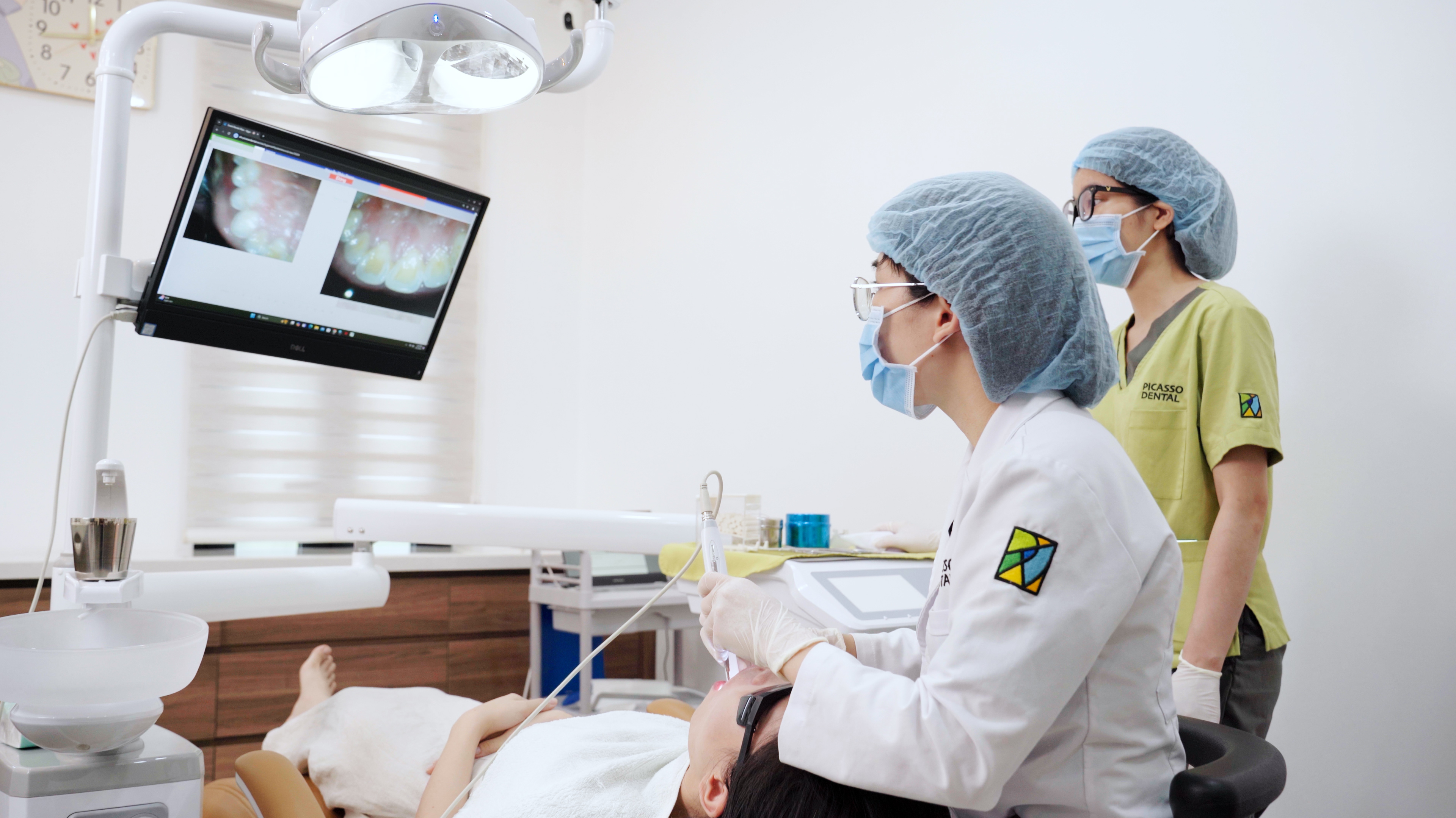 Dental treatment with digital monitor at Picasso Dental Westlake