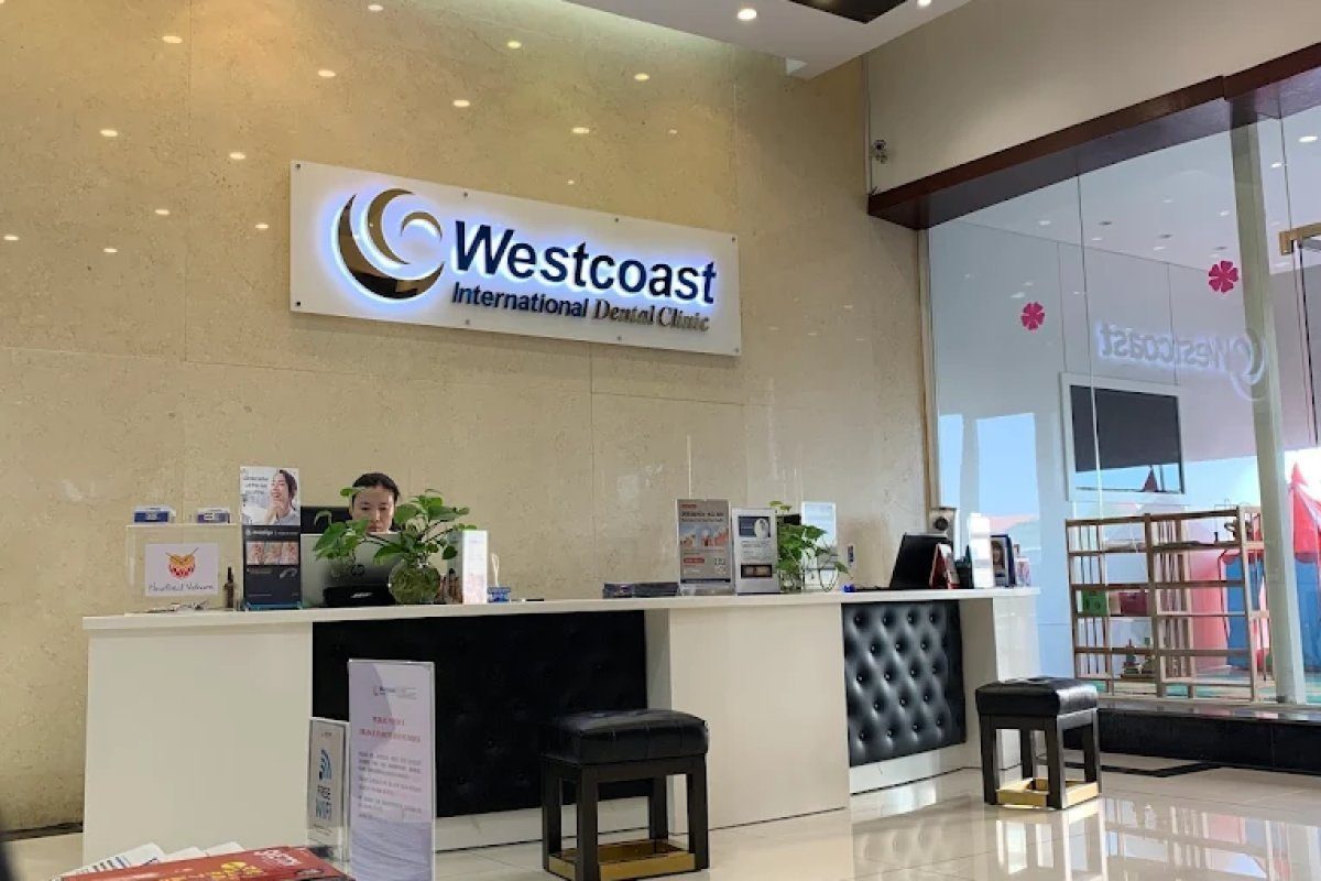 Reception desk with Westcoast International Dental branding